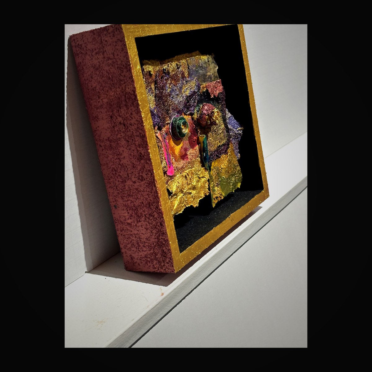 Pink enamel with gold and emerald details — angled perspective revealing depth